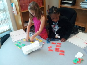 Girls working on an activity together Girls working on an activity together