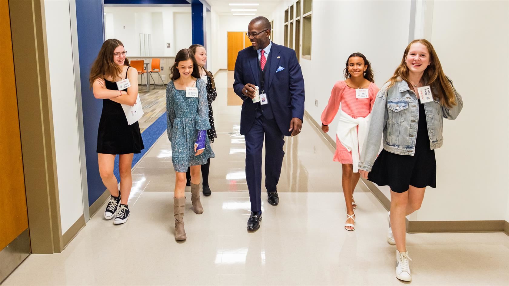 Dr. Taylor tours the school with students.