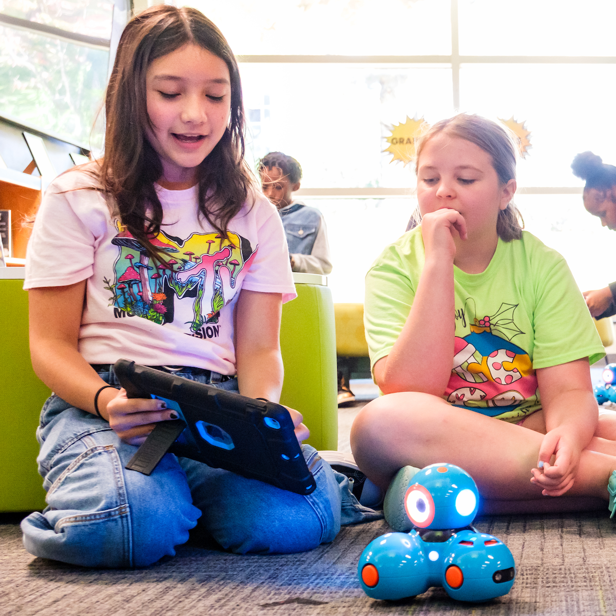  Two students at Carroll Magnet Middle work on robotics programming.