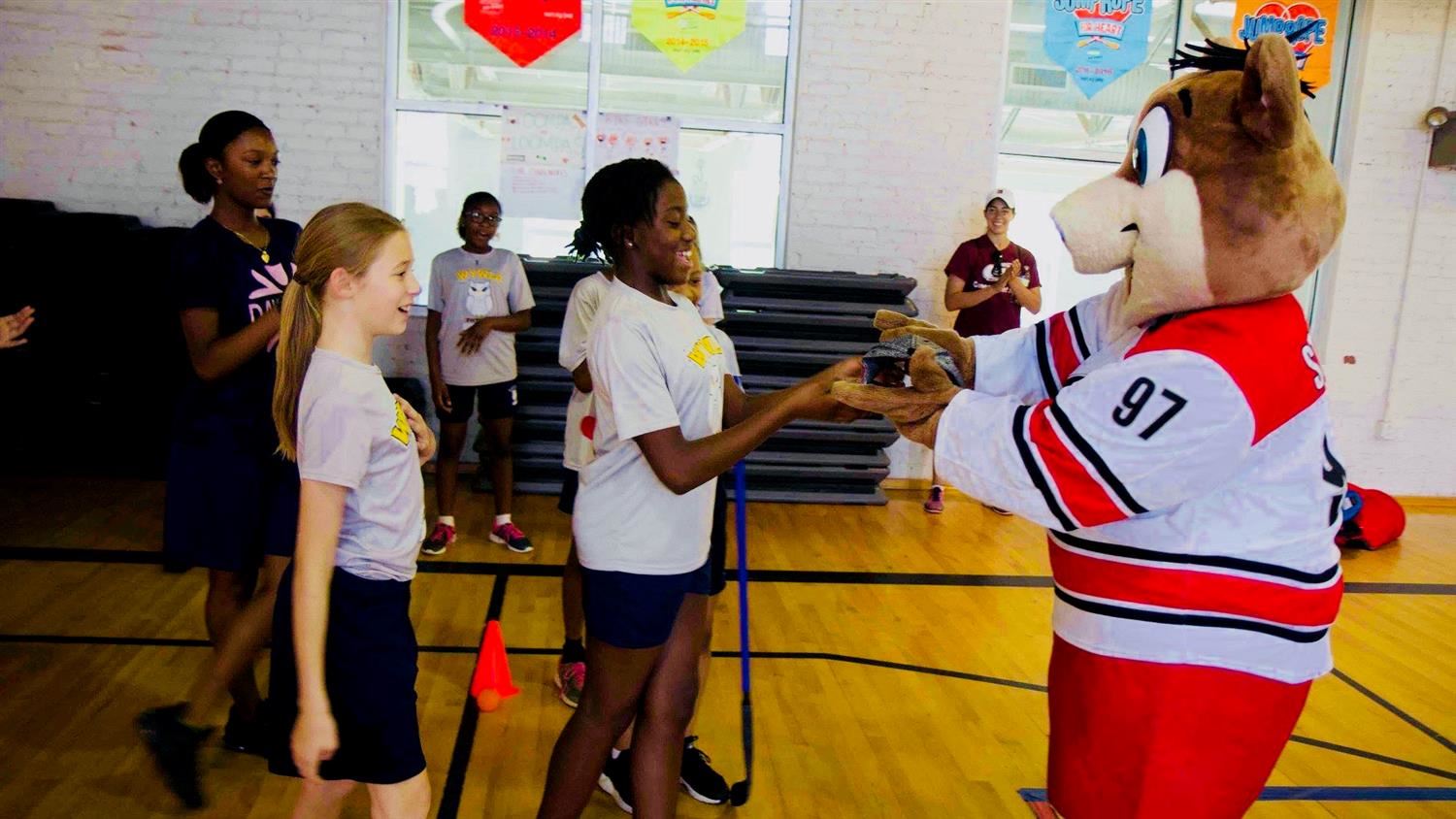 Carolina Hurricanes mascot Stormy exercise with middle school students 