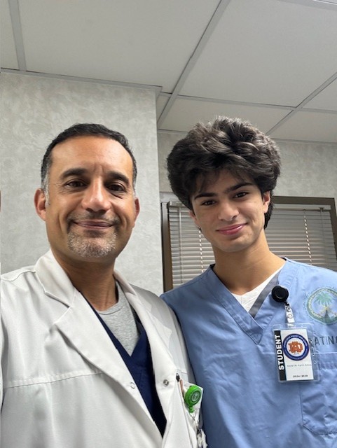Abdel poses with a surgeon from his internship in Saudi Arabia