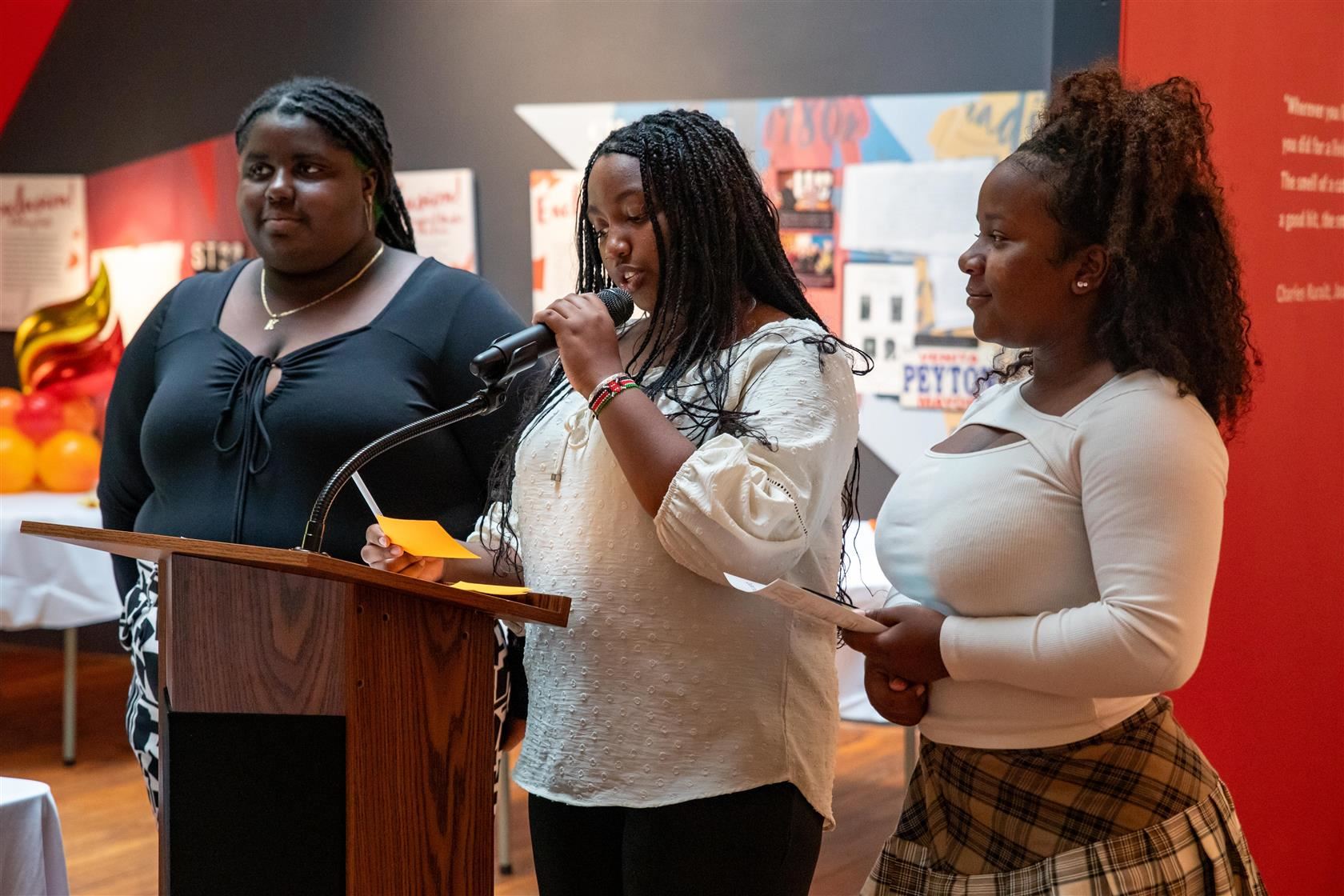 WCPSS Ignite Presentations Three students speak at podium