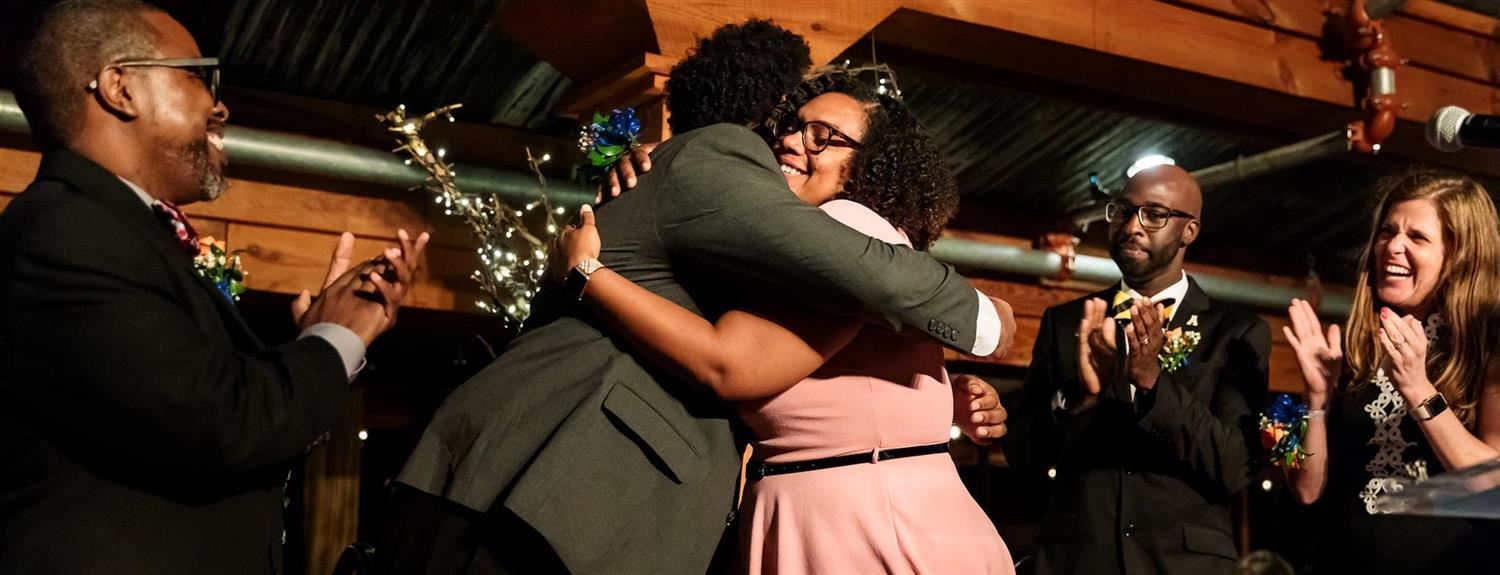 Assistant Principal of the Year Roxann Sykes hugs fellow finalist 