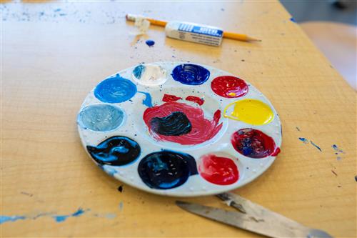 A tray filled with paint from creative students