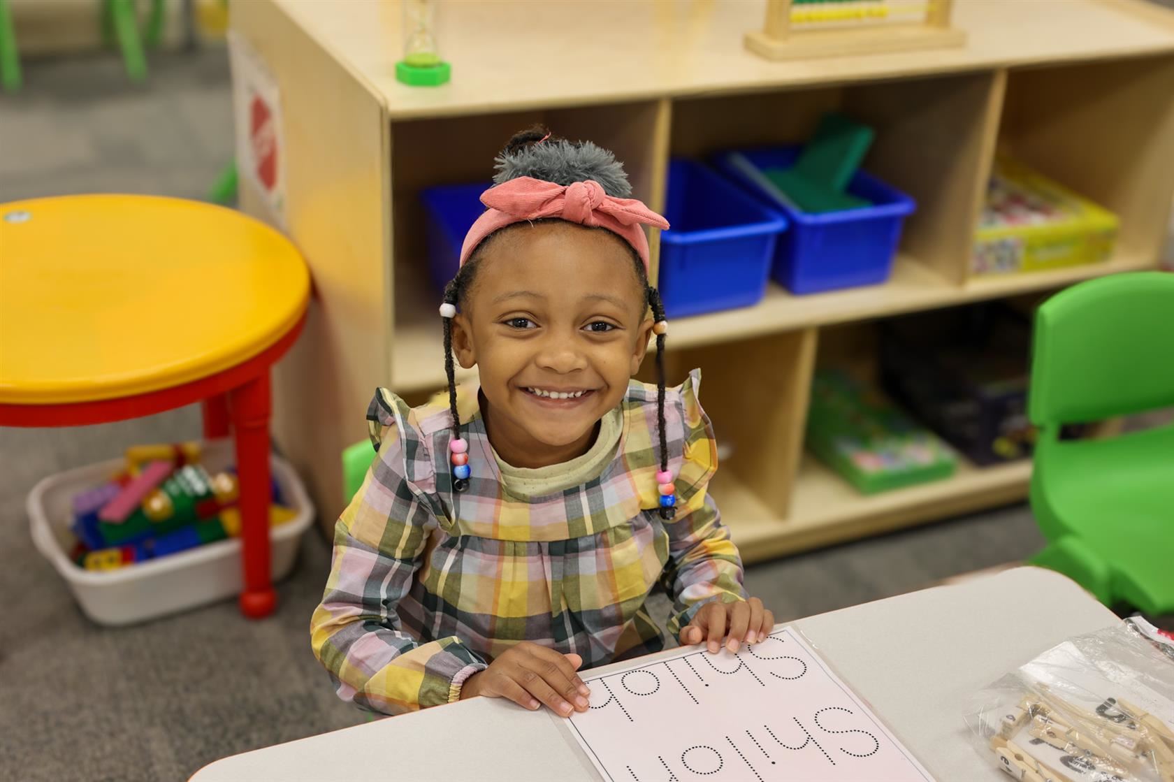 student smiling at early learning center