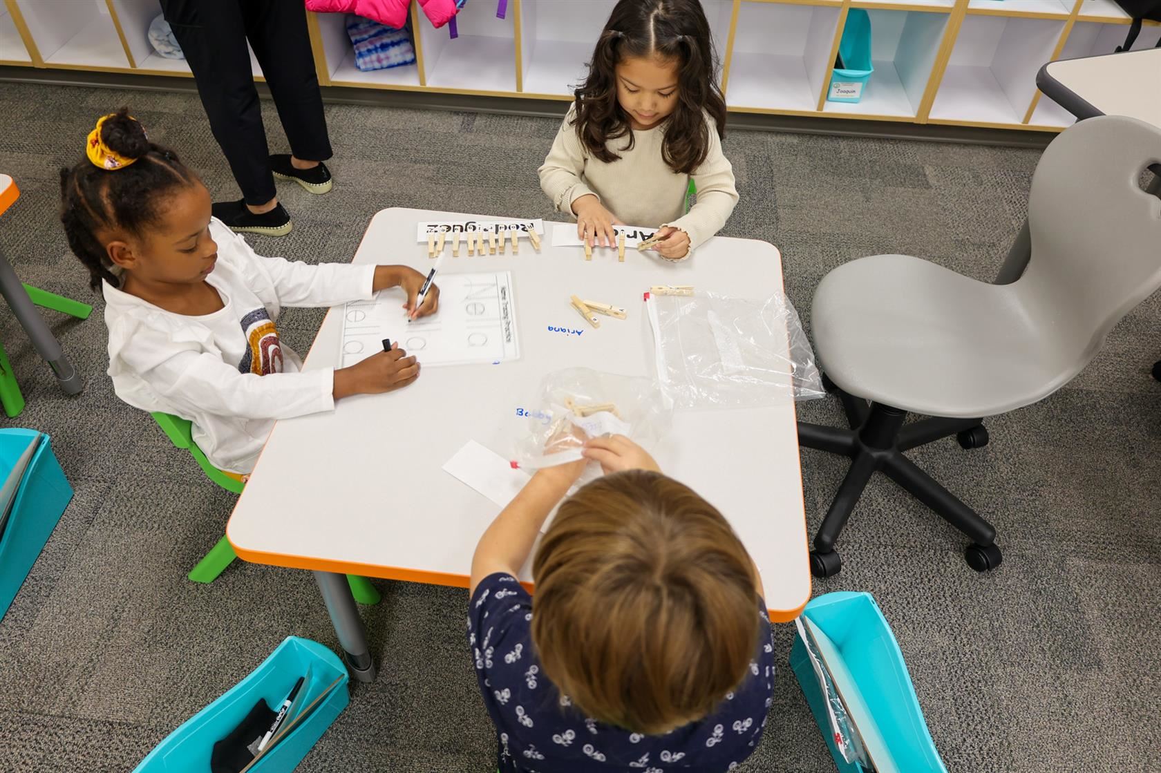 students working at a table at Early Learning Center