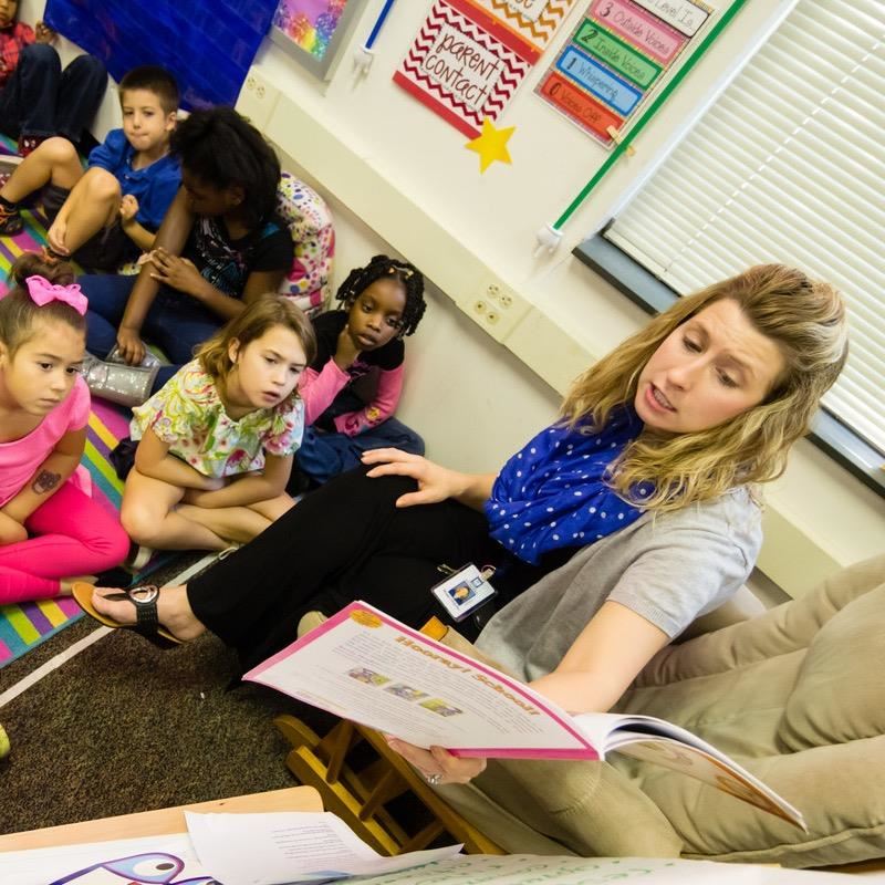 A teacher reads to students. WAKE Up and Read partnership gets national notice 