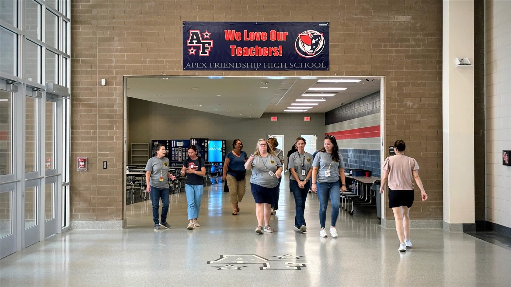 Teachers walking in the hall.