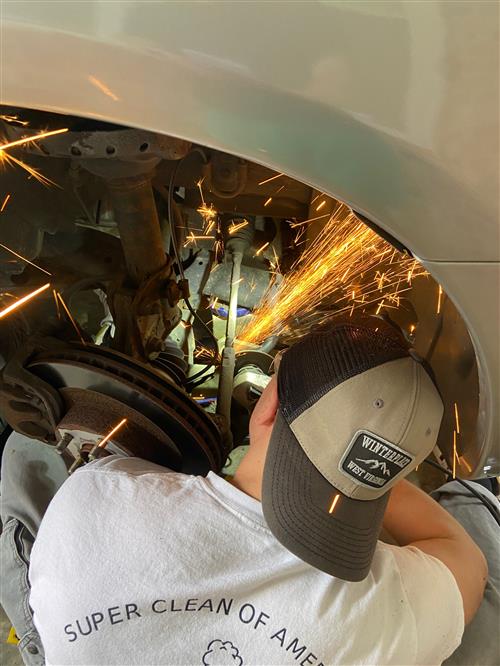 Oliver working on his car
