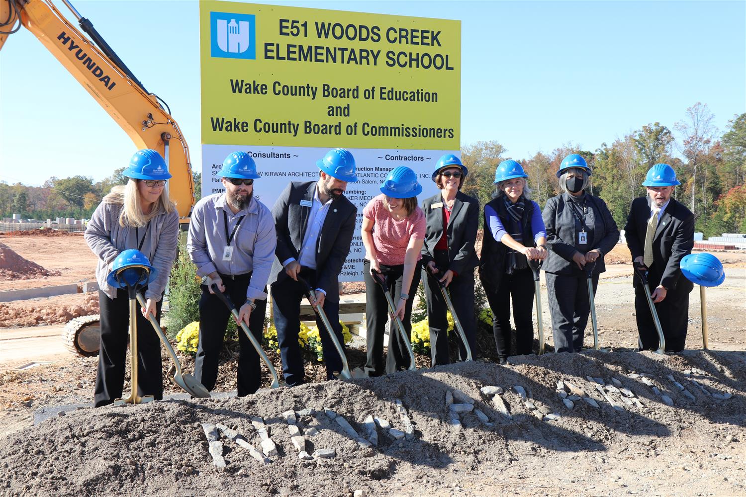Photo of WCPSS staff and elected officials turning dirt at groundbreaking.