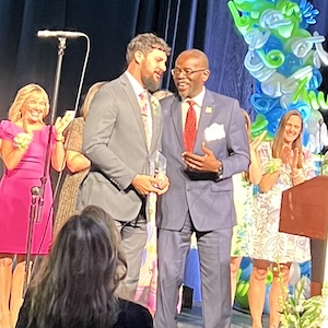  Teacher of the Year Ryan Berglund receives his award from Superintendent Taylor