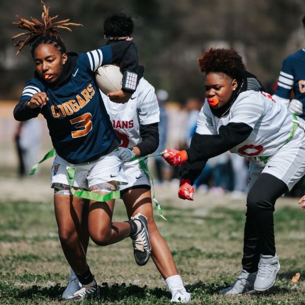  female students playing flag football