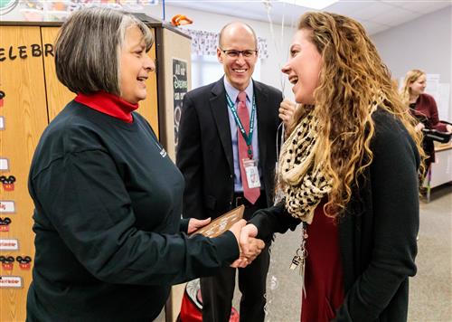 Teacher shaking hands with Superintendent 