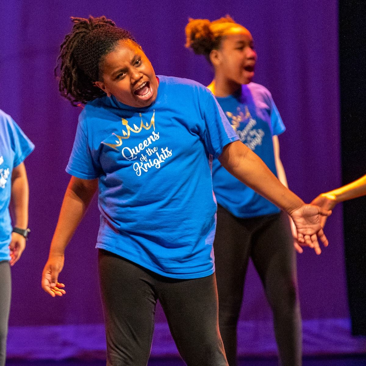  A student performing step at a talent showcase