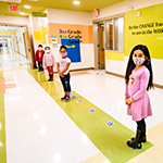  photo of students lined up in a hallway