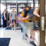  Students rush to class at the start of the school day.