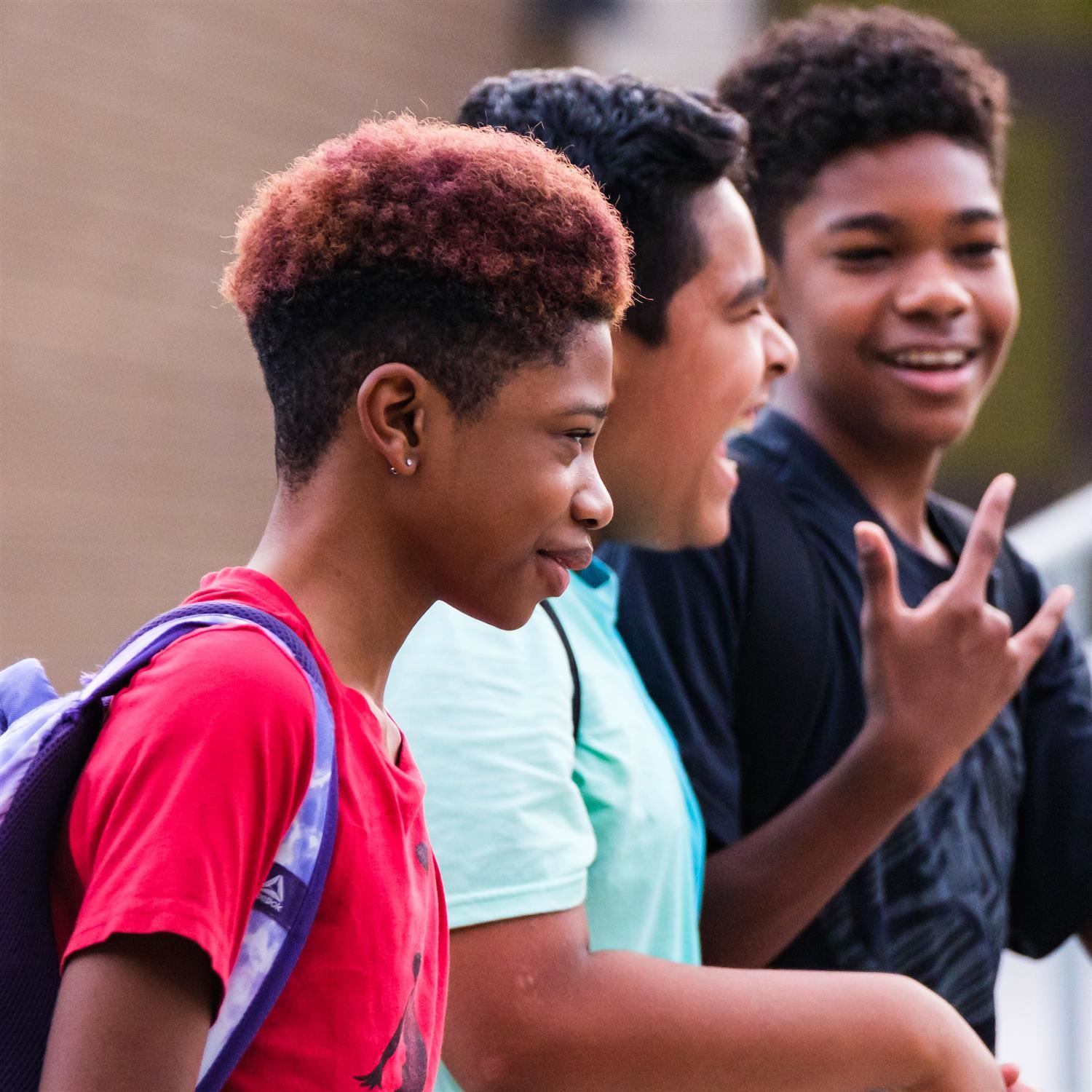  Students smiling as they leave school for the day