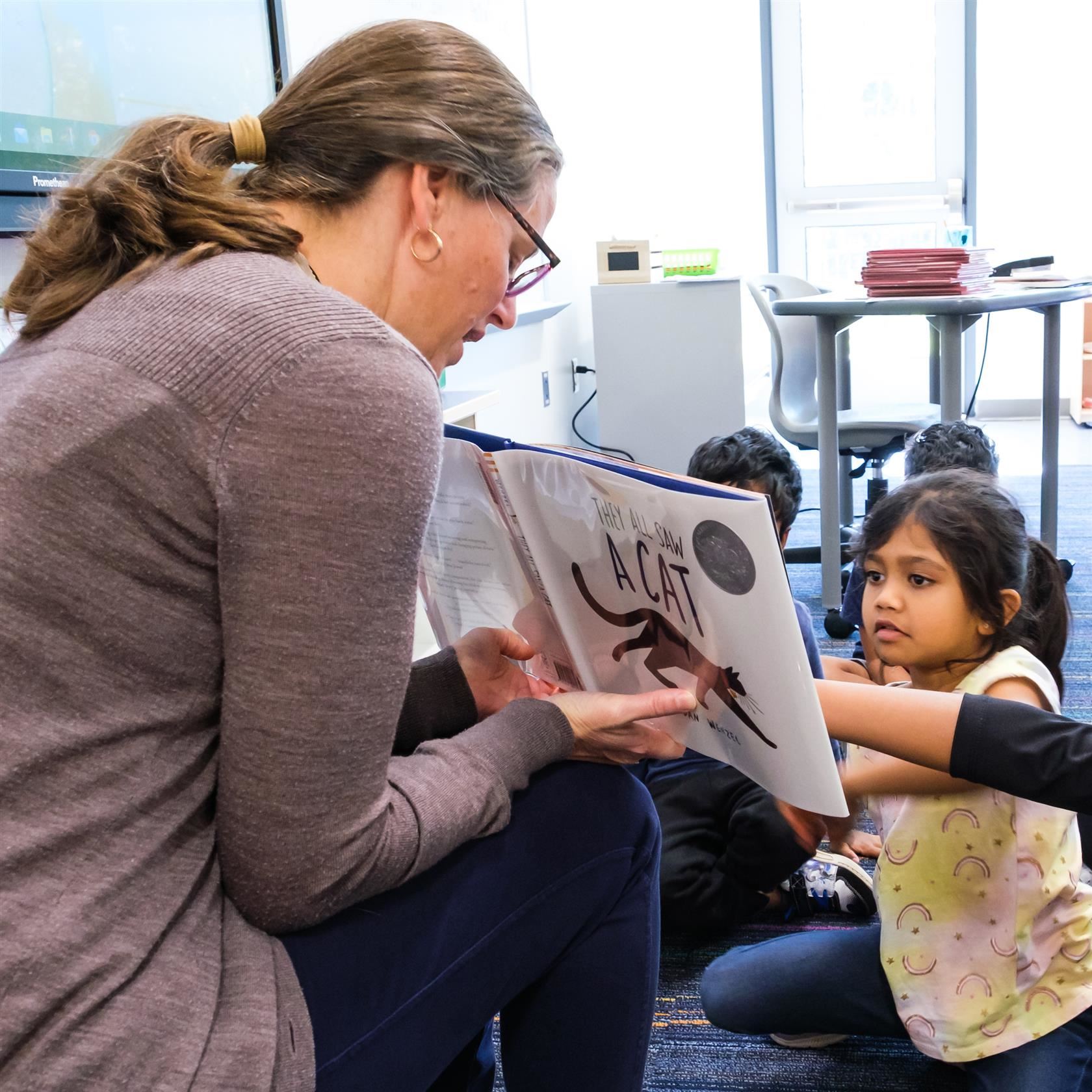  Students and teacher share reading time