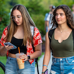  Students walking with phones out