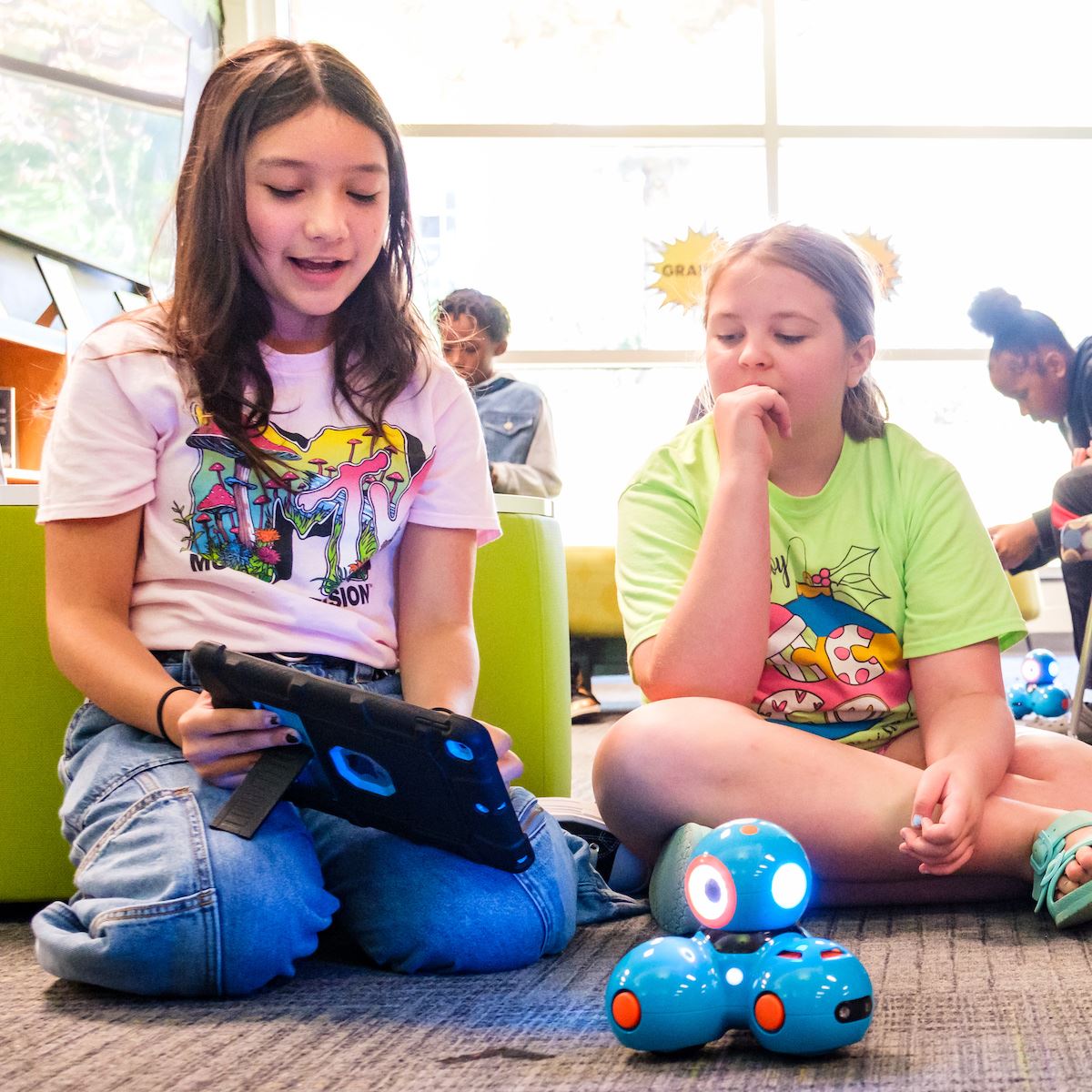  Two magnet students work on a robotics project in the media center