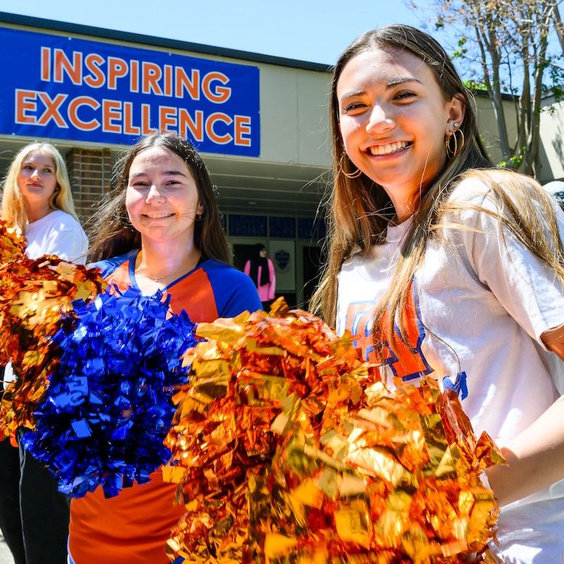  Cheerleaders at Athens Drive High celebrate their school's award