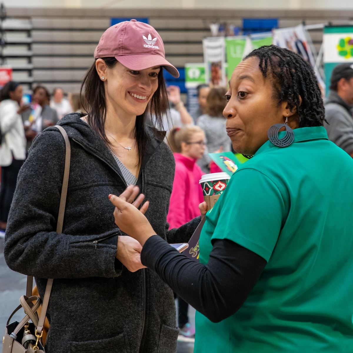  A magnet school staff member talks with a parent