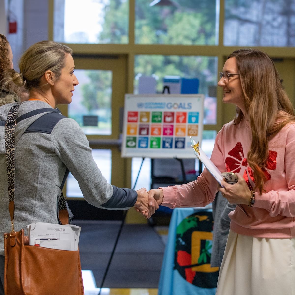 Parents are welcomed as they come to visit a magnet school