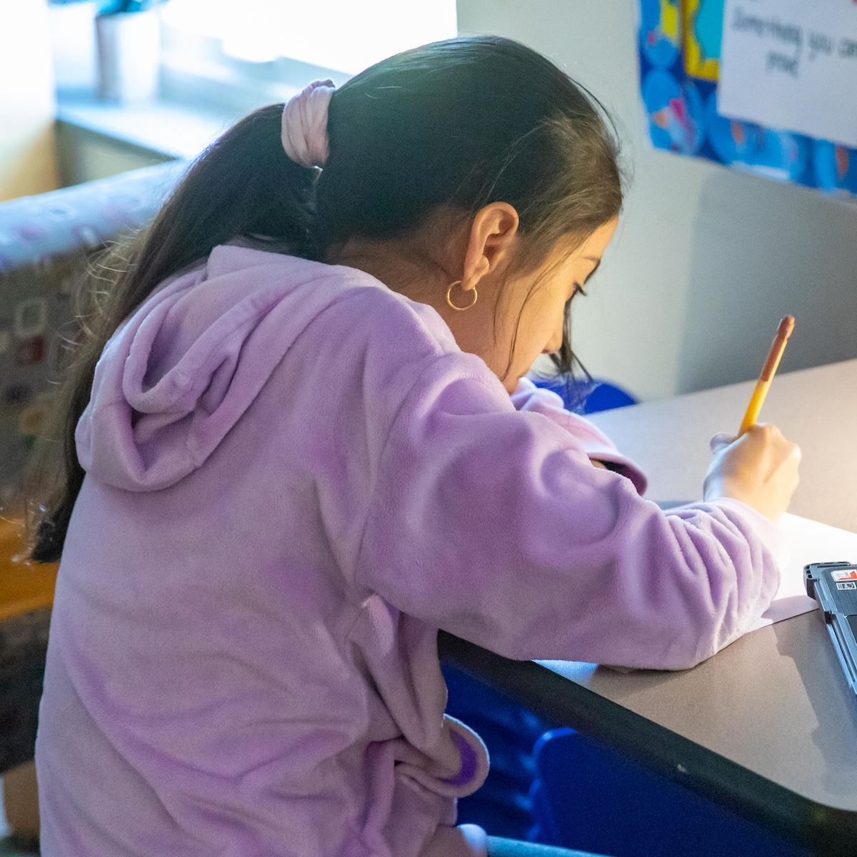  A student taking her EOG test