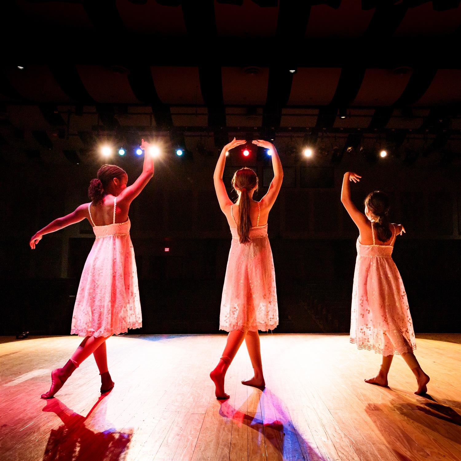  photo of three students dancing