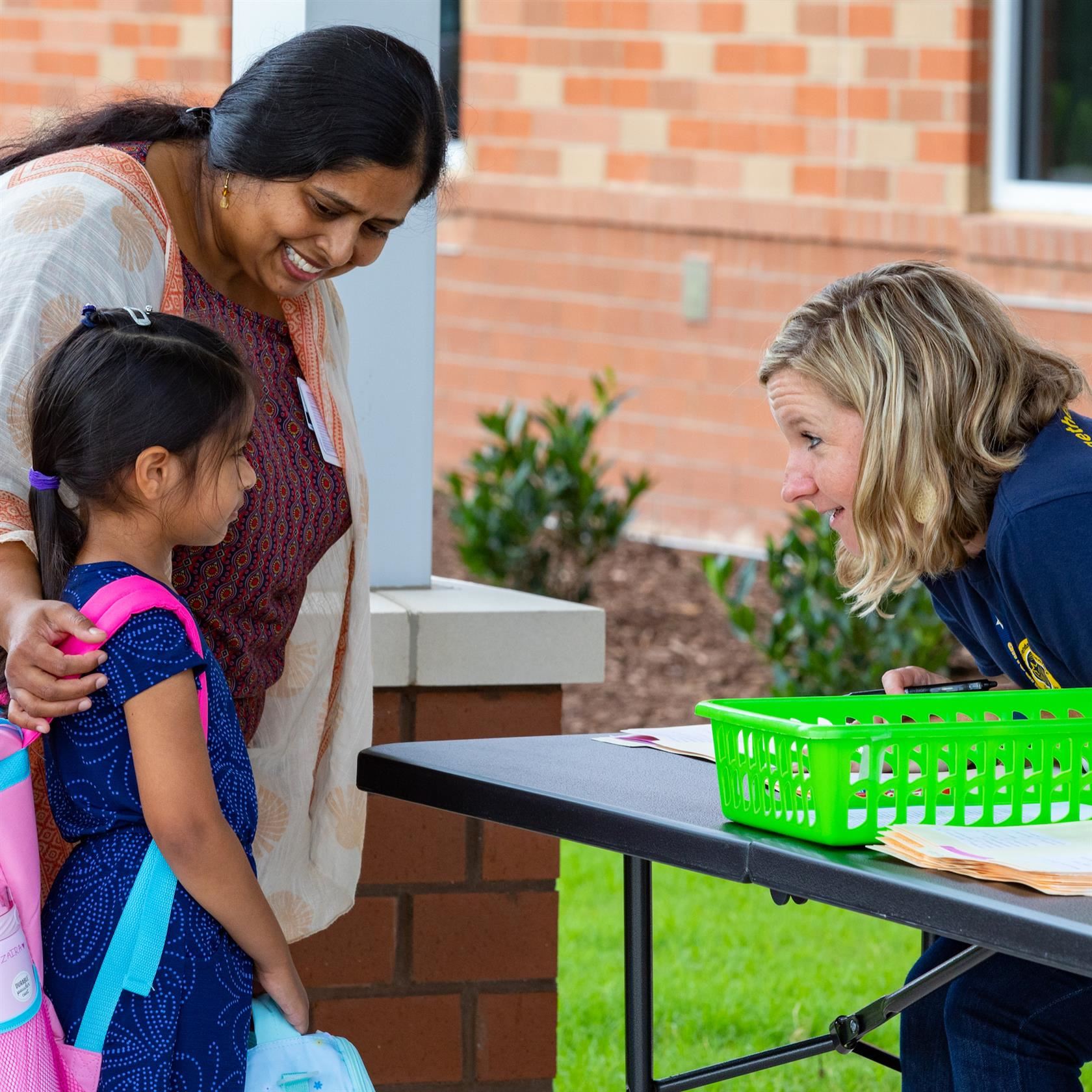  Teacher helps register Pre-K student