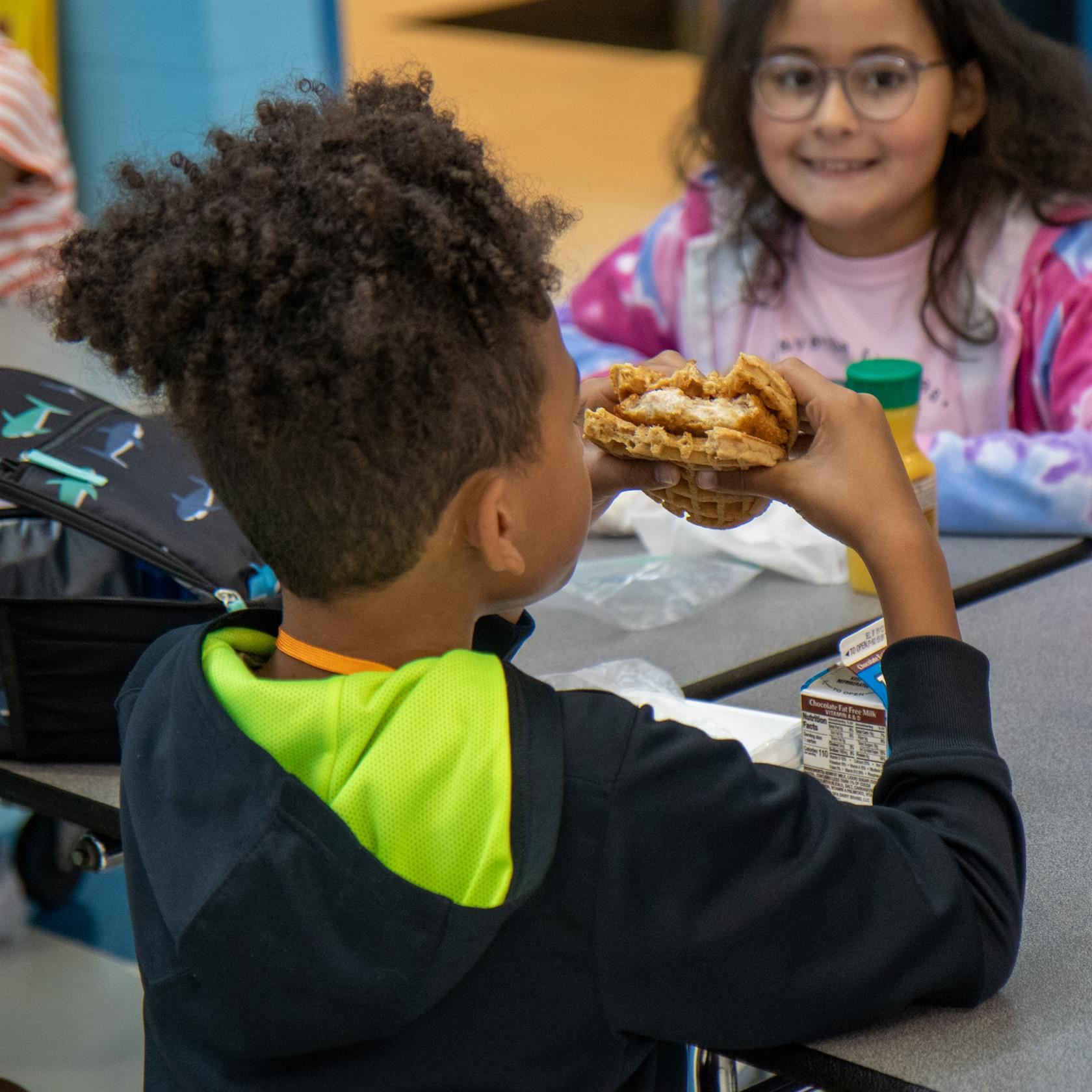  Students enjoying chicken and waffles