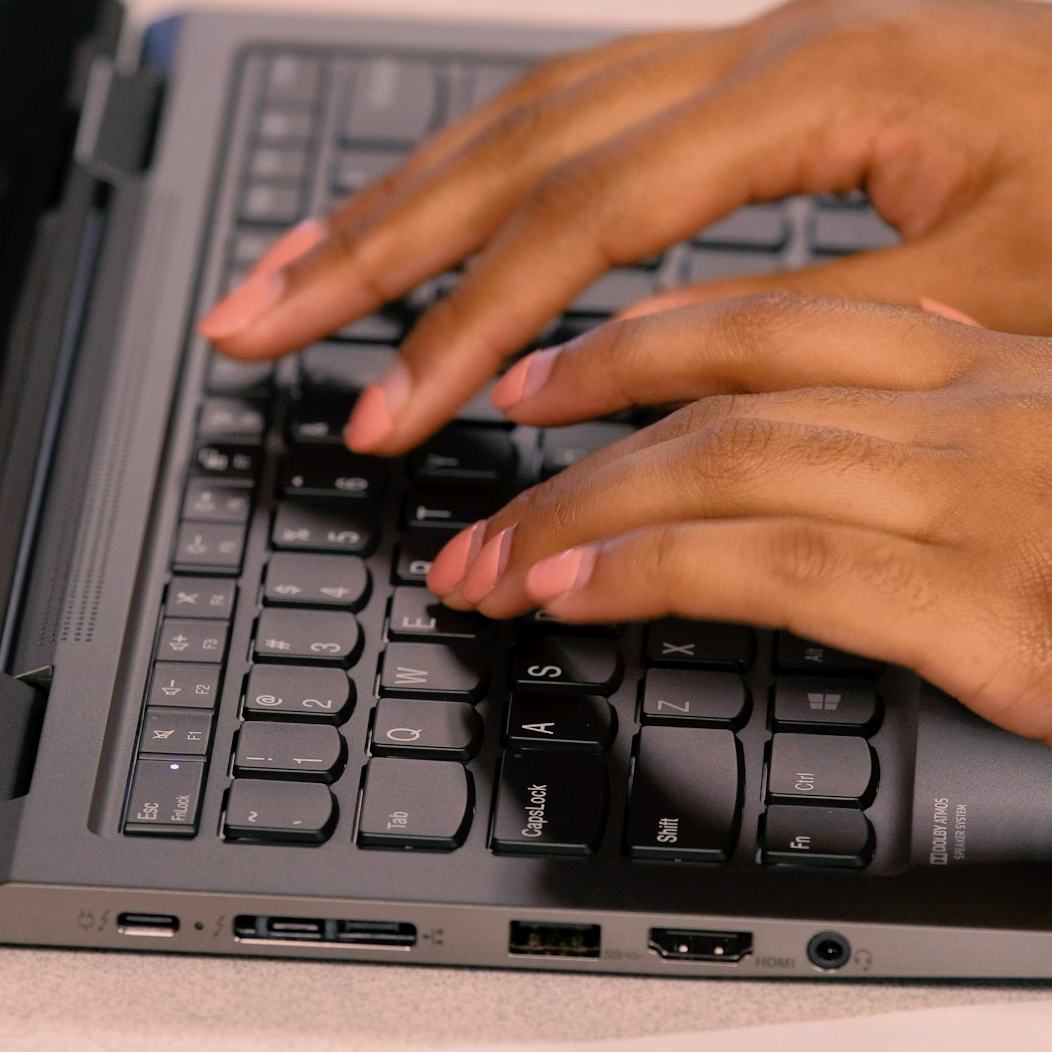 Fingers typing on a keyboard