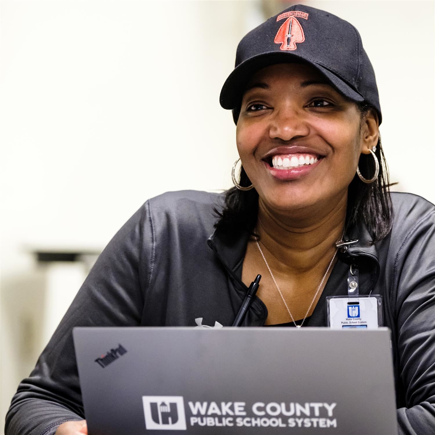 photo of woman sitting in front of a laptop