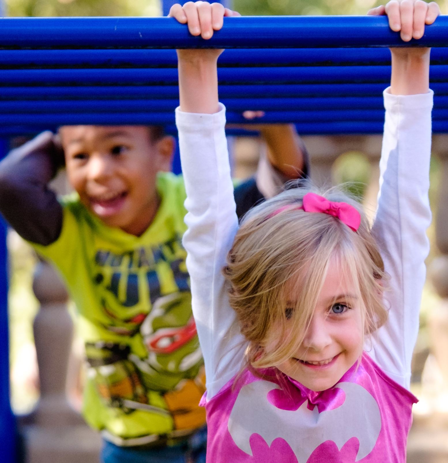  Kindergarteners playing on jungle gym