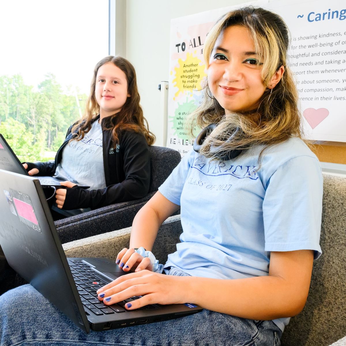 Two students work on an assignment in a learning space