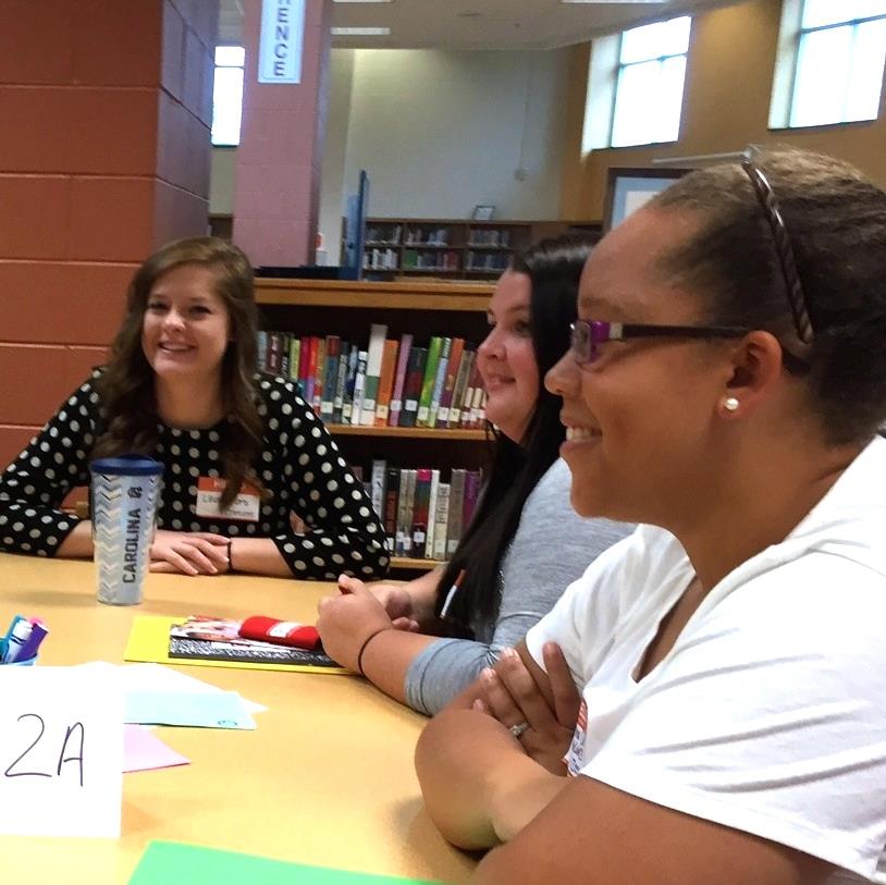  Teachers in a group smiling