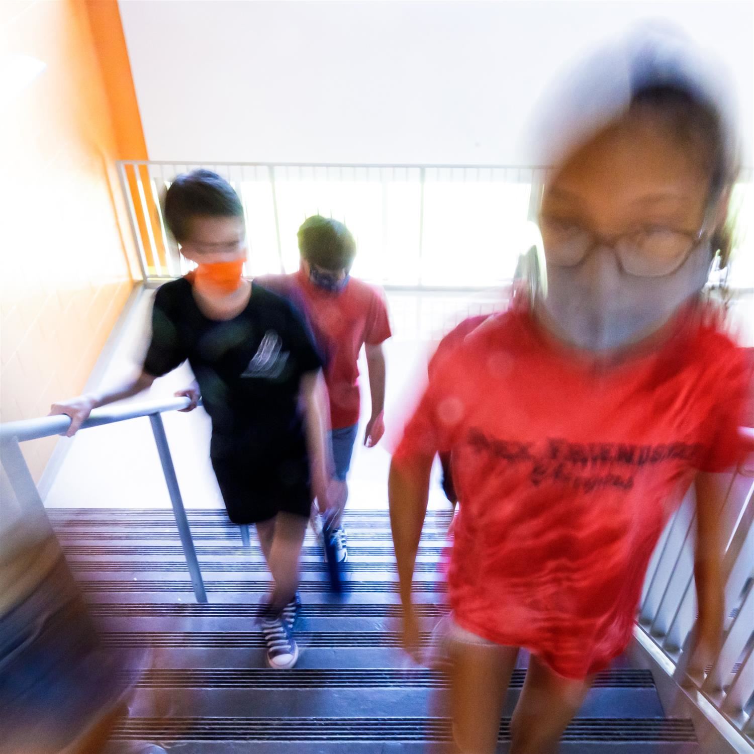  photo of students going up a staircase