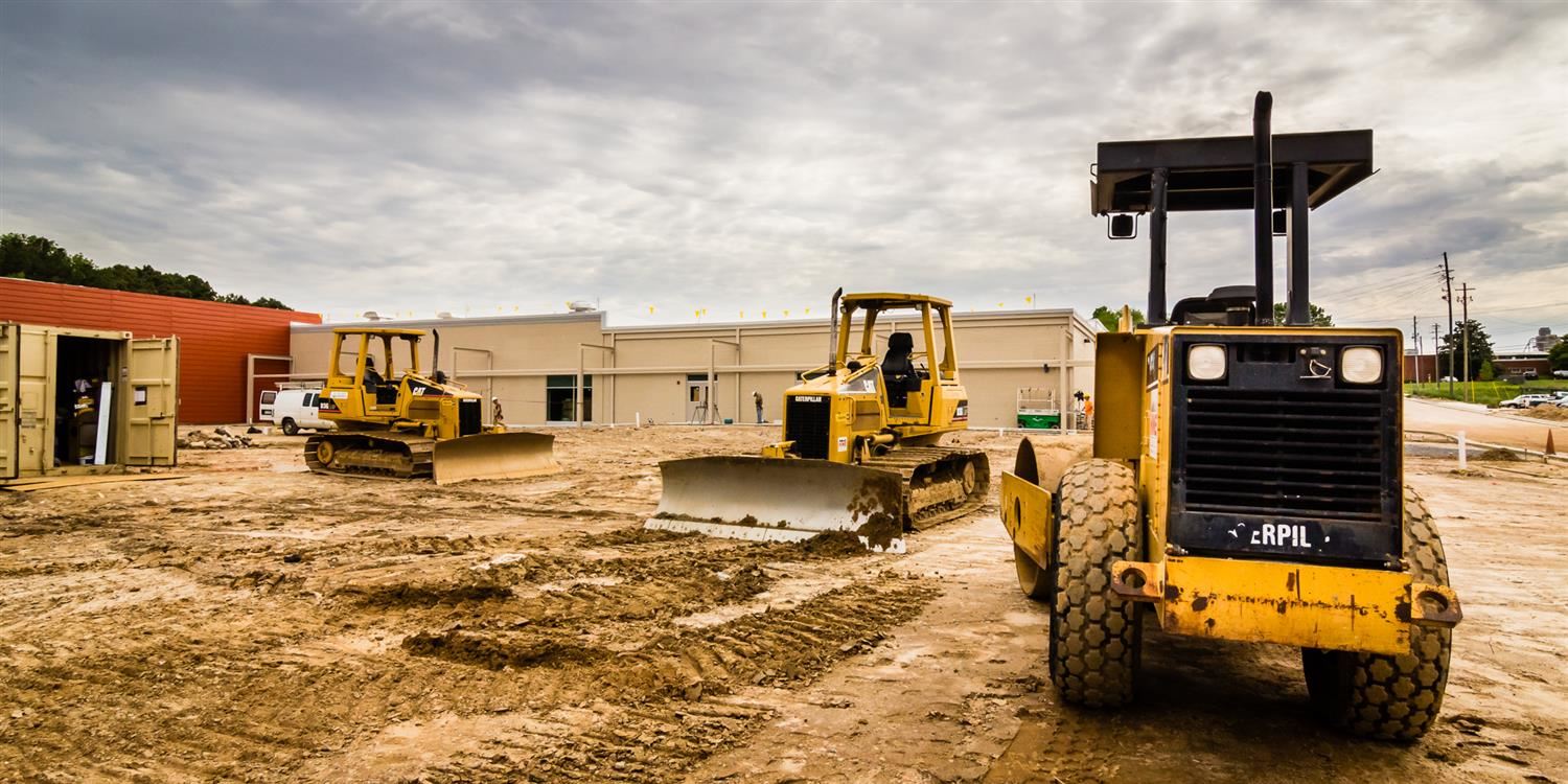 Construction equipment on school building site 