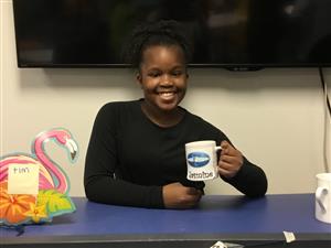 picture of young girl holding coffee mug 