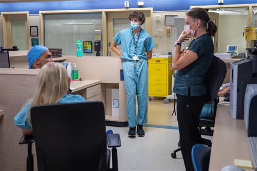 doctors convening with intern