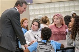 Governor Cooper speaks to students in cafe 