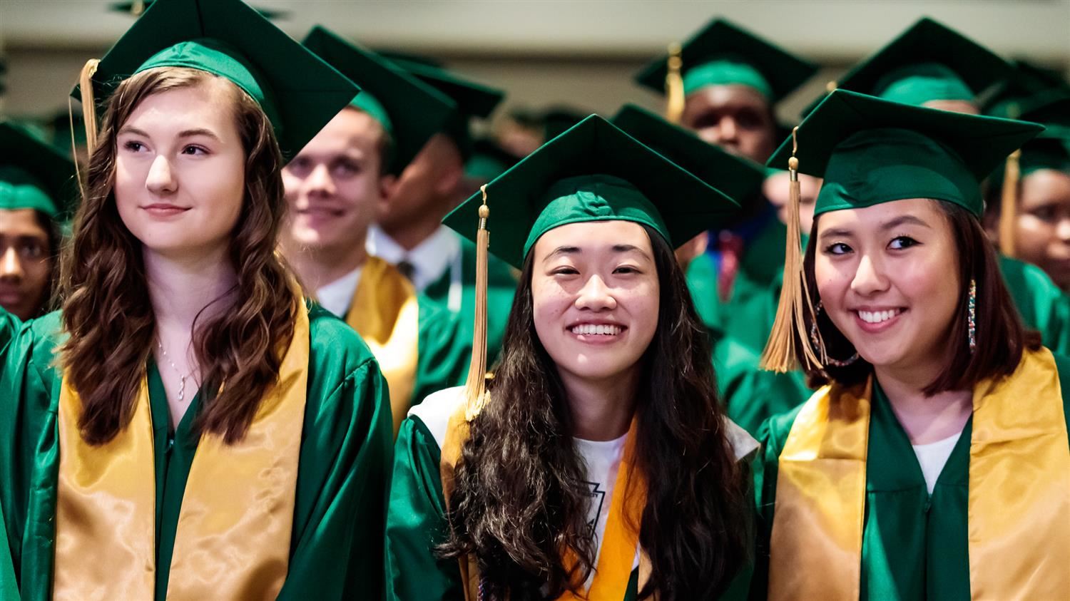 Graduates in cap and gown Graduates in cap and gown