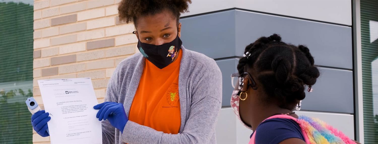 photo of a student receiving a health screening photo of a student receiving a health screening
