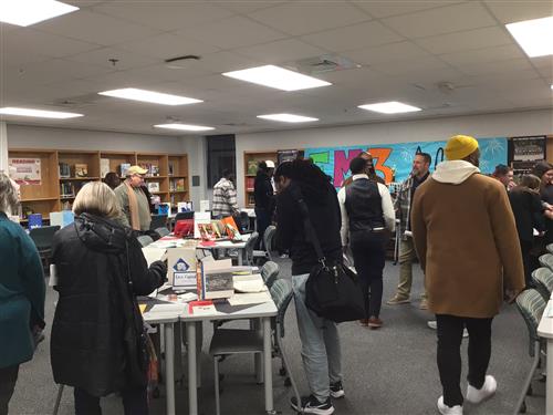 crowd looking at displays