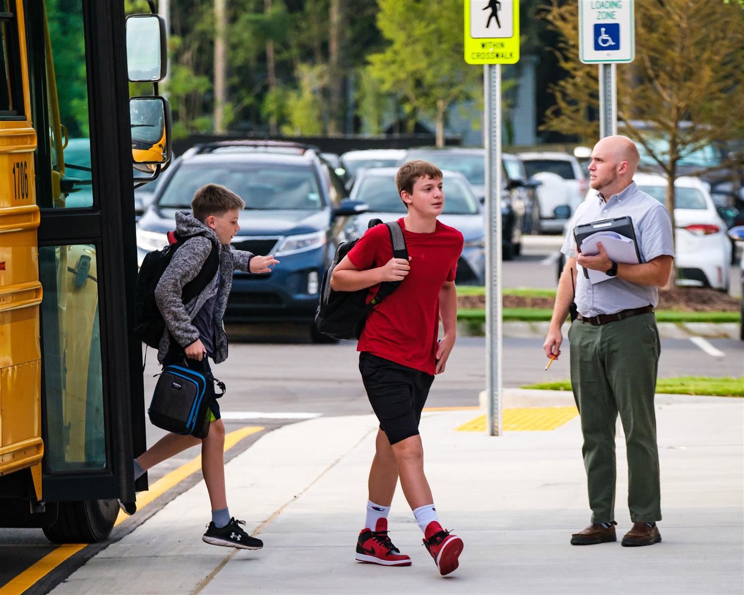 students getting off a school bus students getting off a school bus