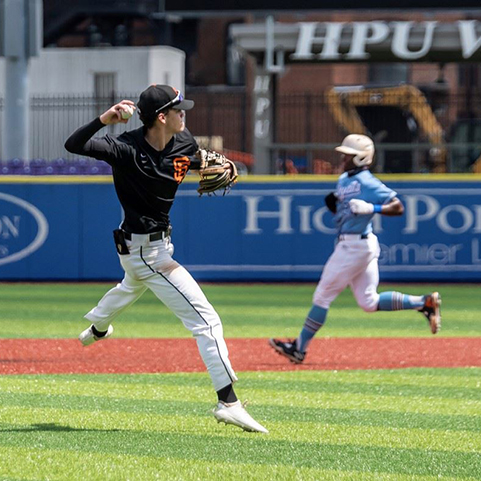  photo of a student pitching a baseball