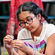  girl building a structure