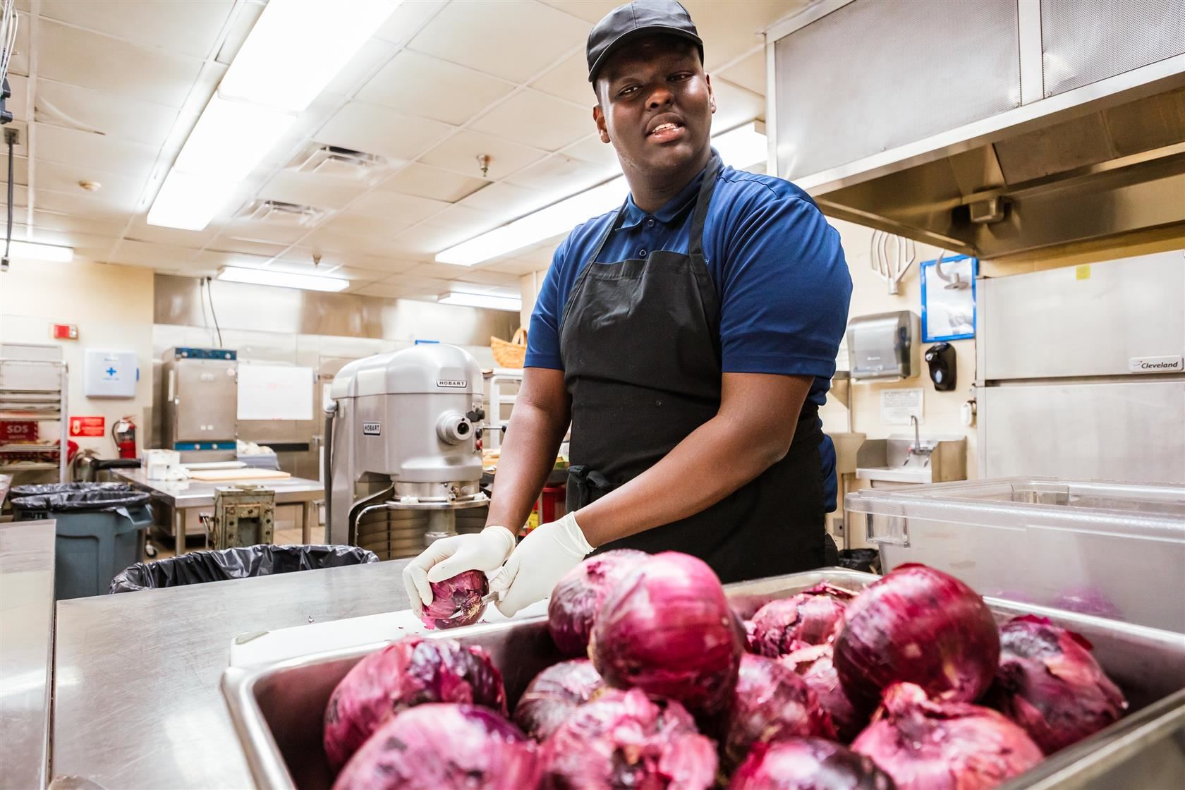 omar adam chopping onions
