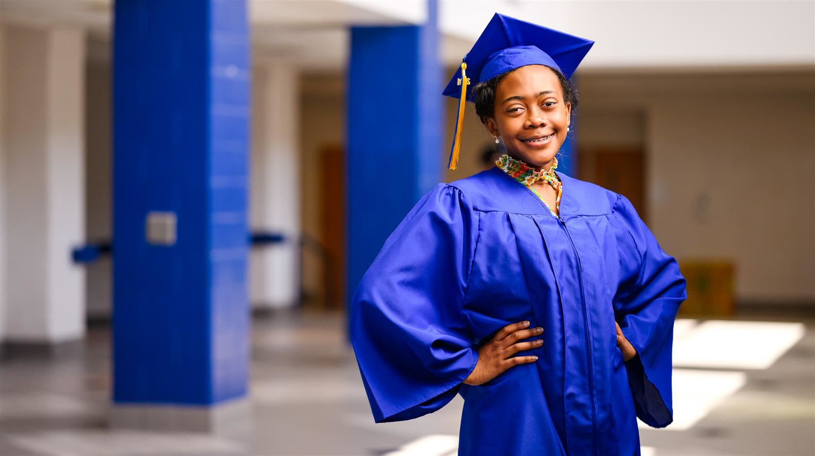 Layla Roland posing in cap and gown