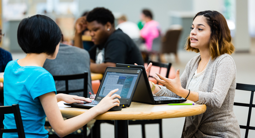 Students at Vernon Malone College and Career Academy work in teams in one of the school's collaborative learning spaces. 